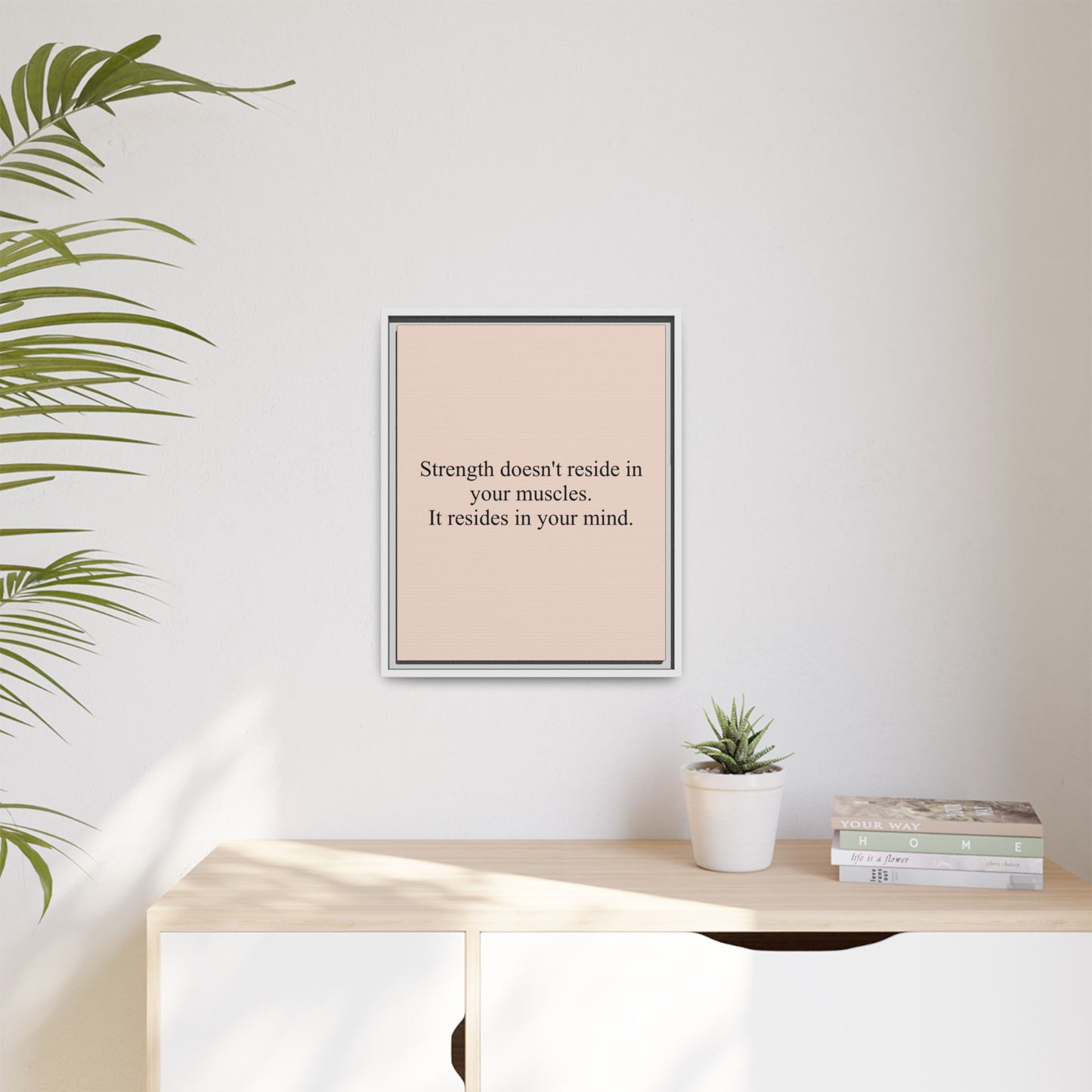 Framed Motivational Canvas — “Strength doesn't reside in your muscles. It resides in your mind.”