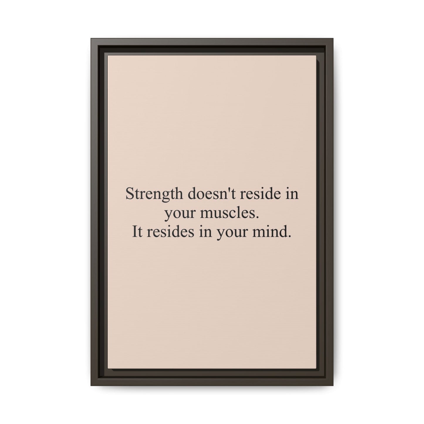 Framed Motivational Canvas — “Strength doesn't reside in your muscles. It resides in your mind.”