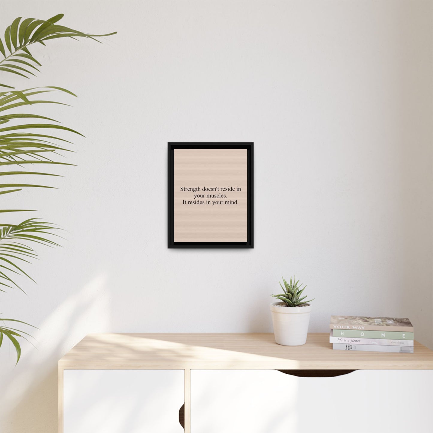 Framed Motivational Canvas — “Strength doesn't reside in your muscles. It resides in your mind.”