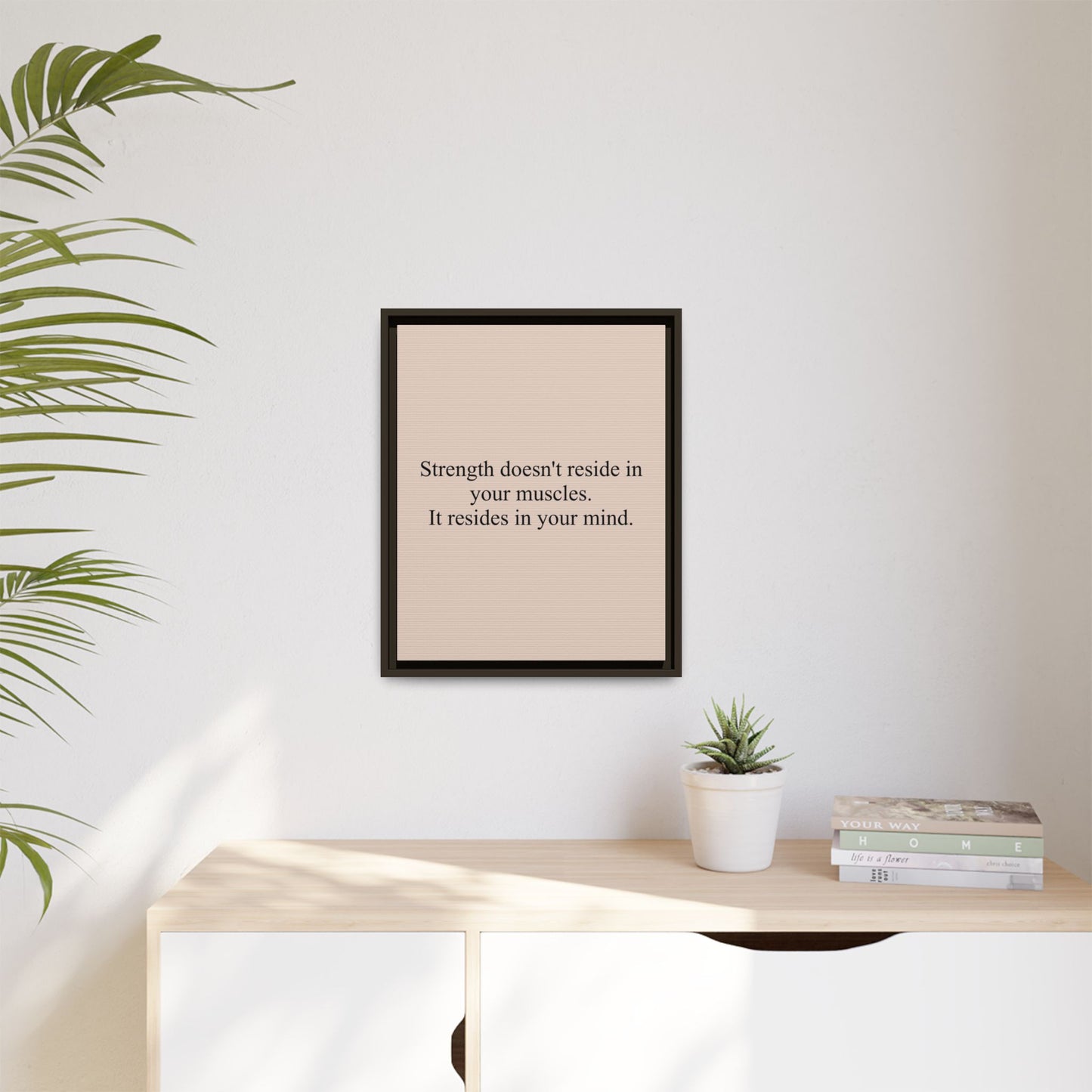 Framed Motivational Canvas — “Strength doesn't reside in your muscles. It resides in your mind.”